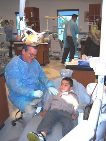 Dentist examining a child