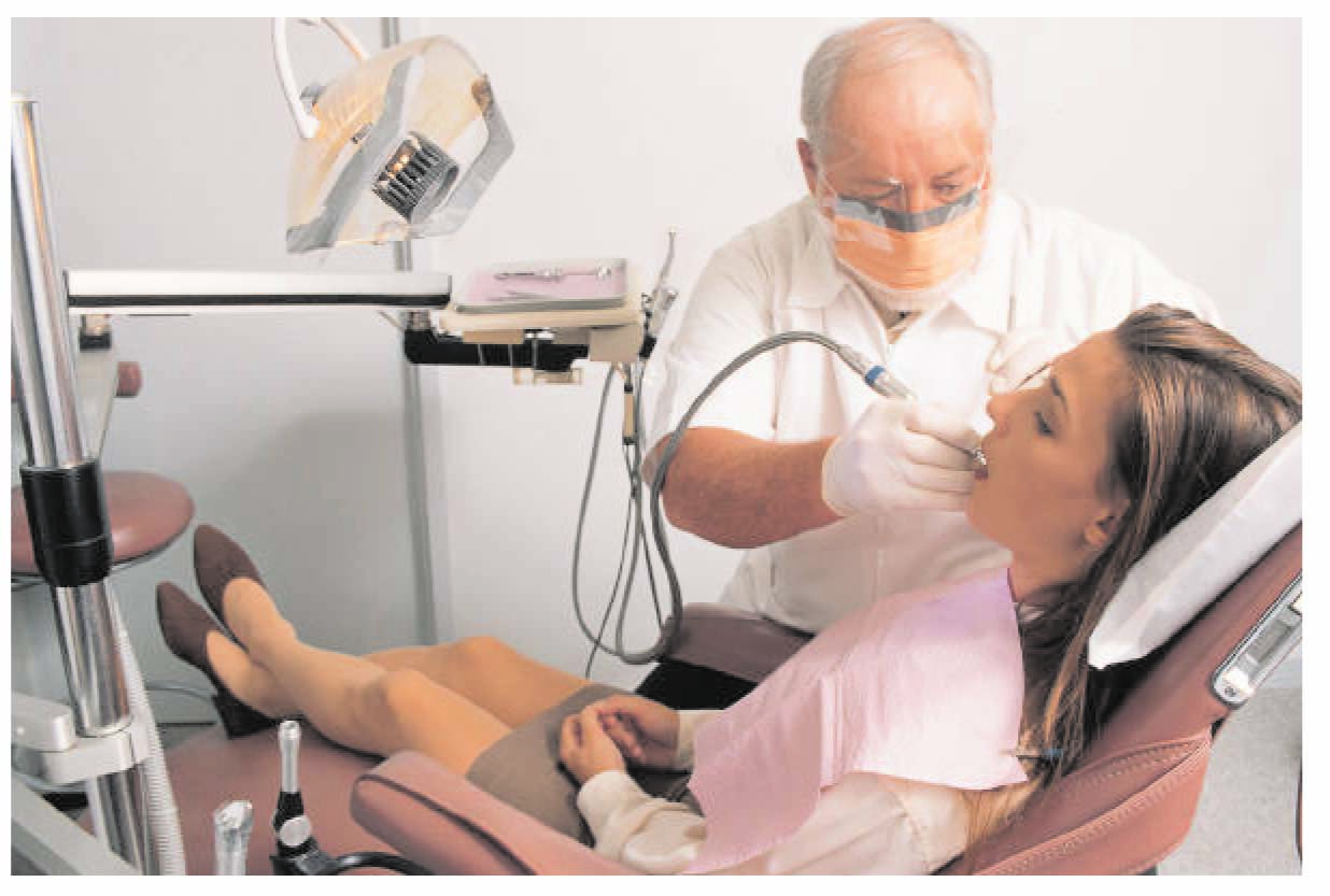 Dentist performing procedure